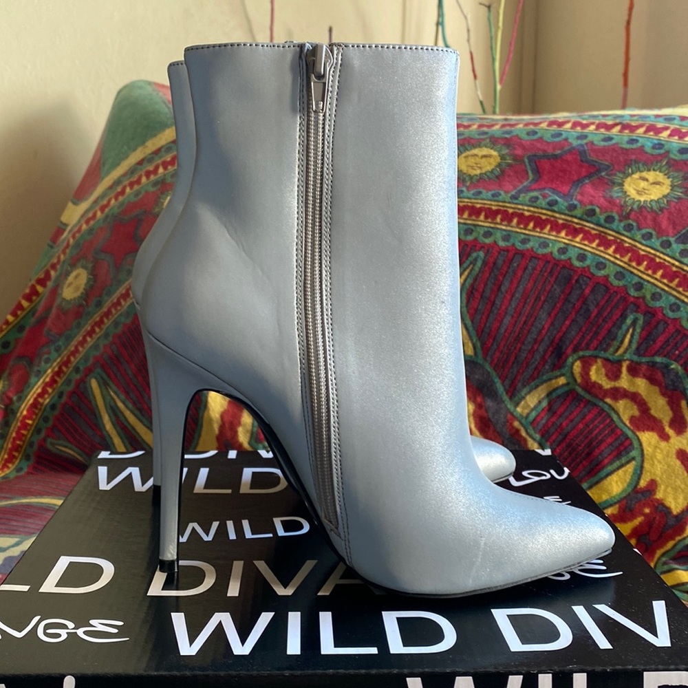 Silver zip up heeled booties